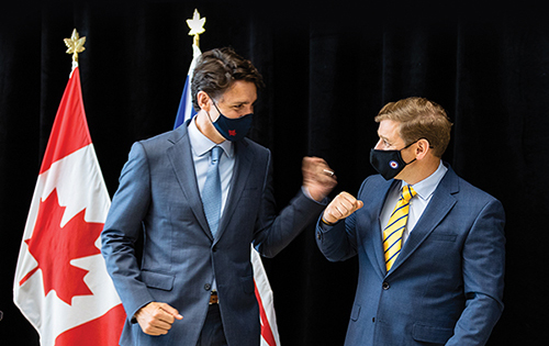 Prime Minister Justin Trudeau and NL Premier, Andrew Furey, fist bumping