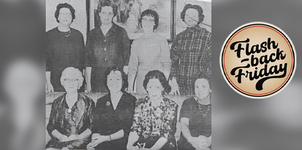 a group of 8 women of various ages, 4 seated, 4 standing behind, dressed in typical, conservative, 1960s fashion