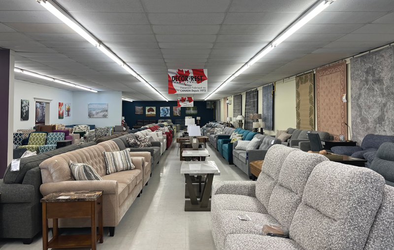 a large showroom of furniture, mostly sofas and accent chairs in this case